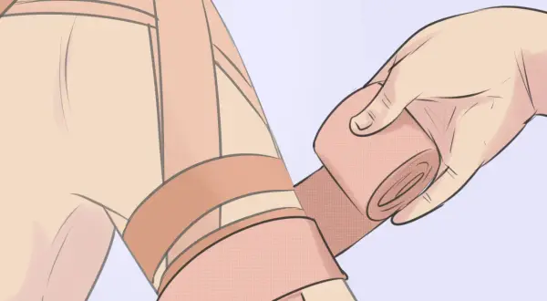 Application d'un strap pour soulager une tendinite à l'épaule.